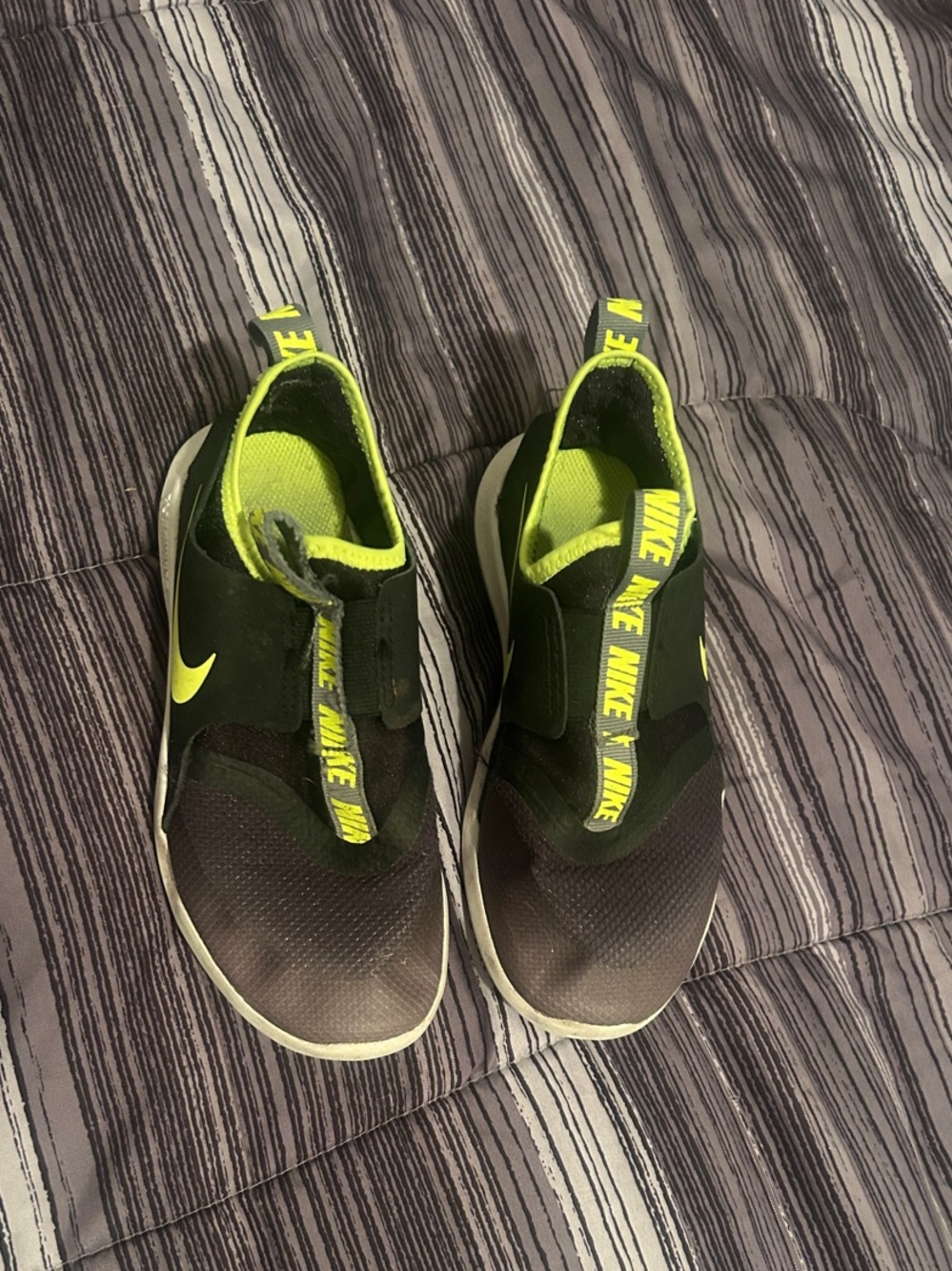 Nike Kids Black Slip-On Sneakers with Neon Yellow Accents